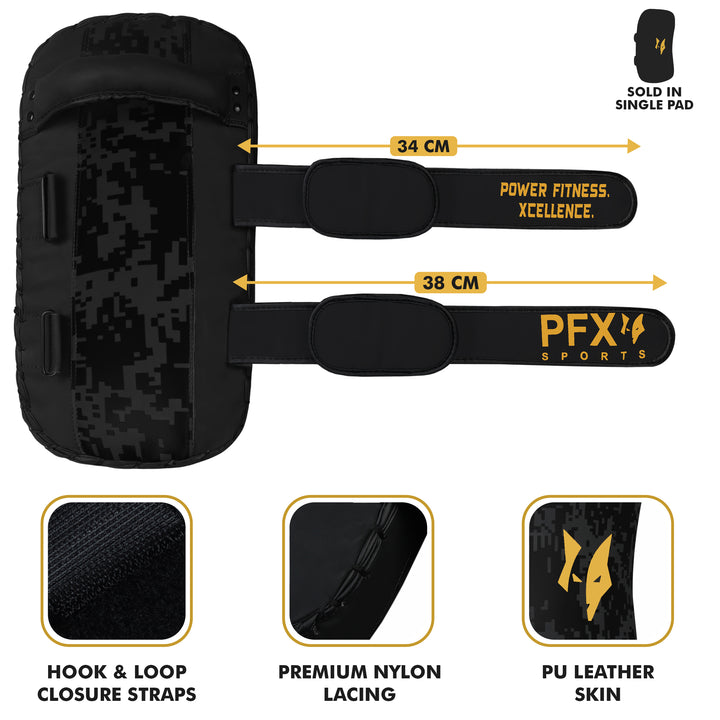Trainer holding PFX Sports strike shield with a fighter landing a powerful roundhouse kick, demonstrating heavy impact absorption.