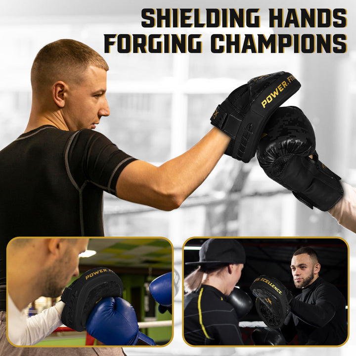PFX Black and Gold focus mitts displayed in a professional gym environment, signifying their suitability for high-intensity, commercial training.