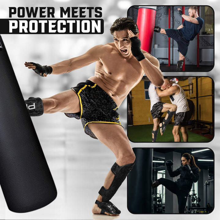 A pair of PFX Black and White shin guards displayed in a professional gym environment, ideal for martial arts schools and intense sparring sessions.